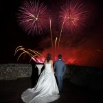 Wedding couple watching their professional fireworks display at Leeds Castle
