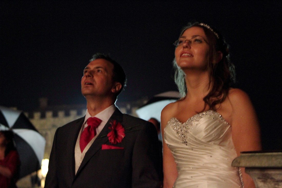 Wedding couple watching fireworks