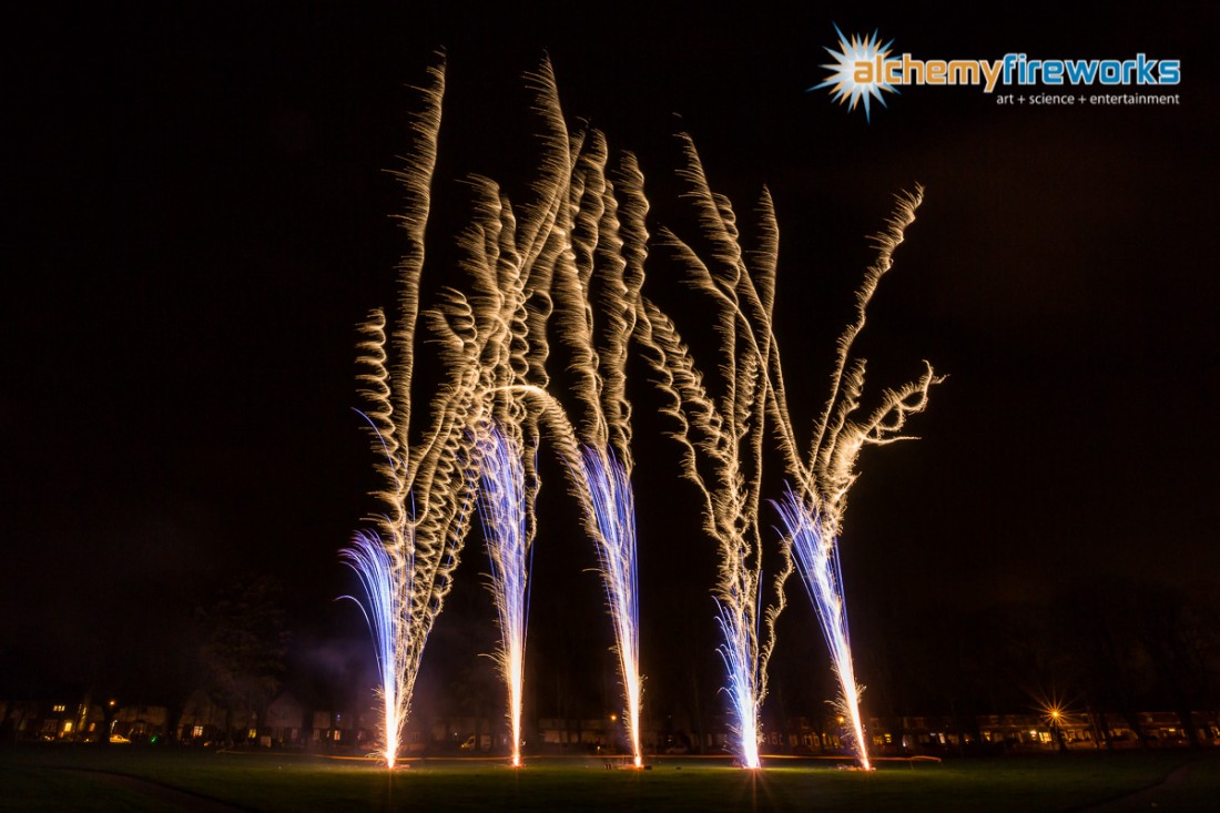 Silver whirling fireworks in the sky at Haverhill Recreation Ground