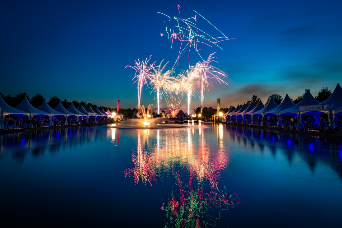 Fireworks reflected in the Long Water at Hampton Court Palace