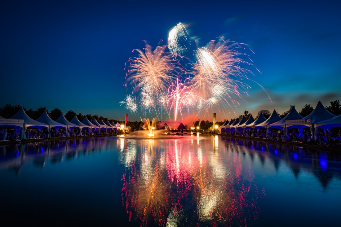 Fireworks reflected in the Long Water at Hampton Court Palace