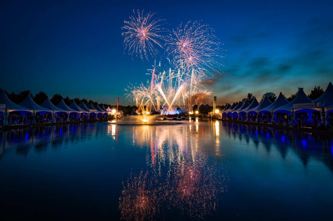 Fireworks reflected in the Long Water at Hampton Court Palace