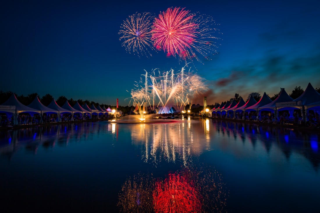 Fireworks reflected in the Long Water at Hampton Court Palace