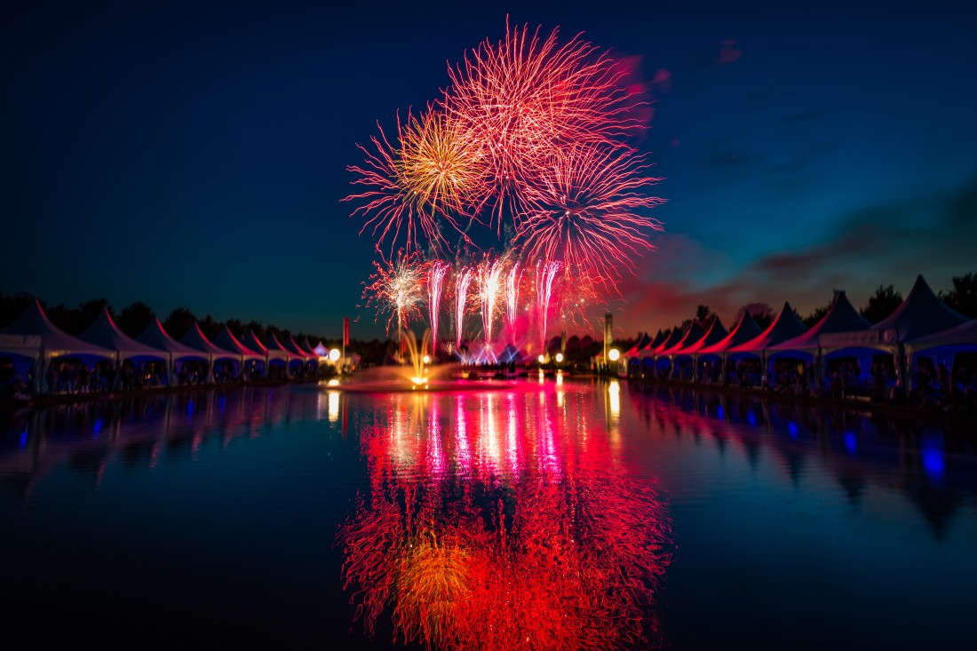 Fireworks reflected in the Long Water at Hampton Court Palace