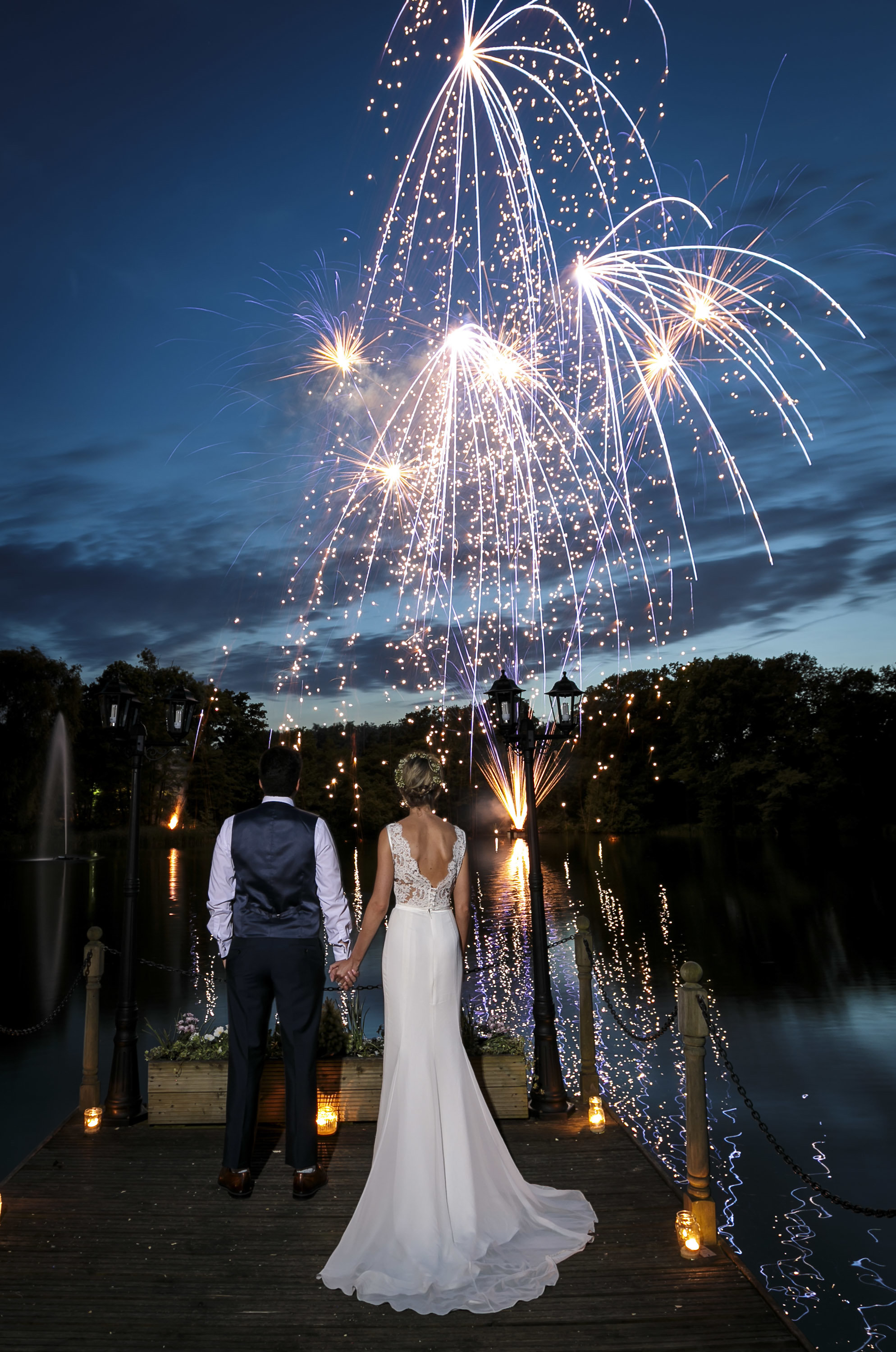 Stunning wedding fireworks over the water at Inn On The Lake, Kent