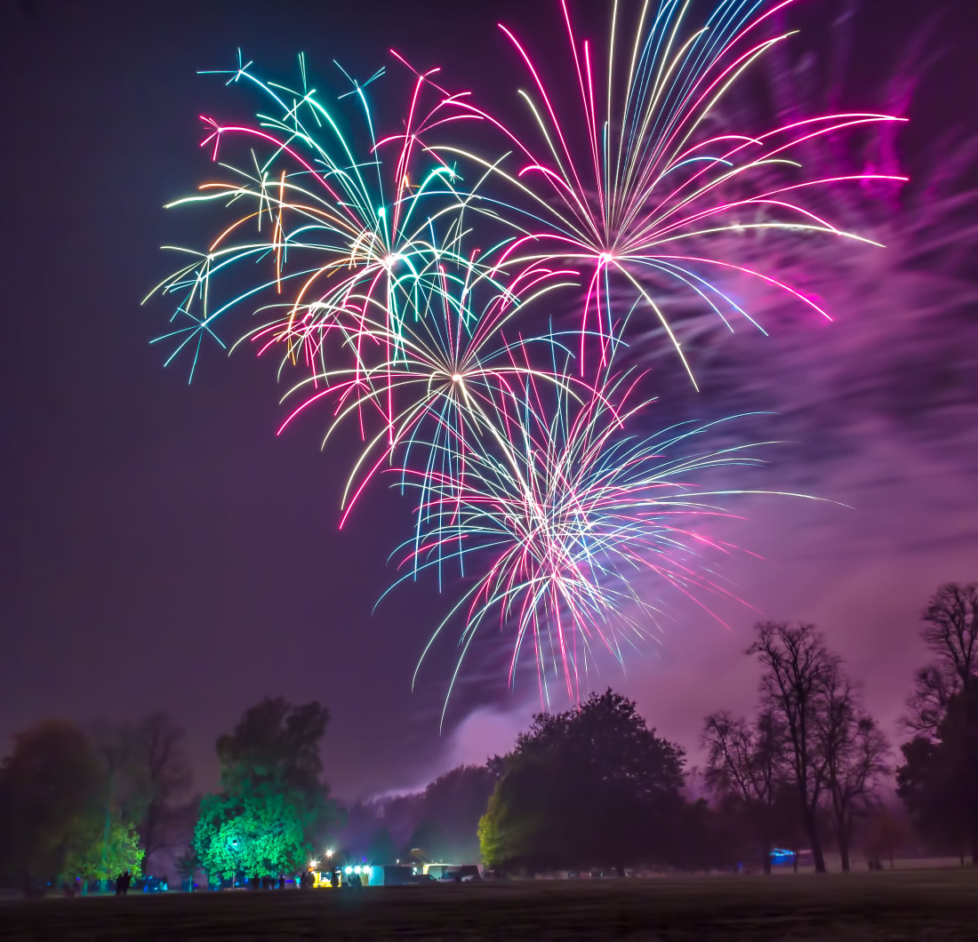 colourful fireworks bursting over Christchurch Park in Ipswich as part of a professional display for the scouts