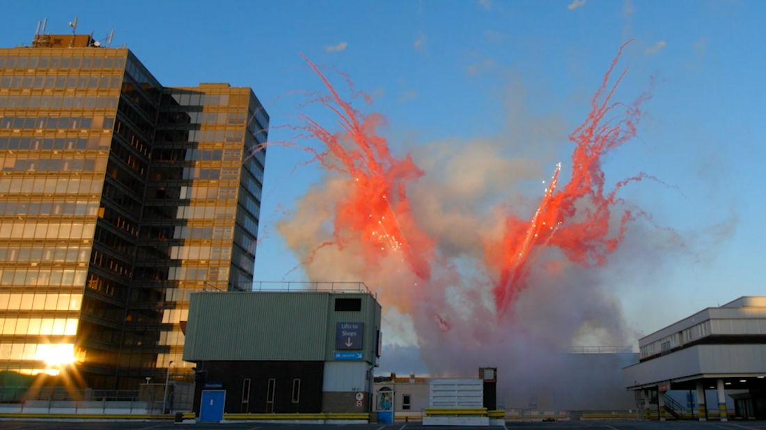 Bright red smoke trails for a daylight fireworks display in Middlesbrough